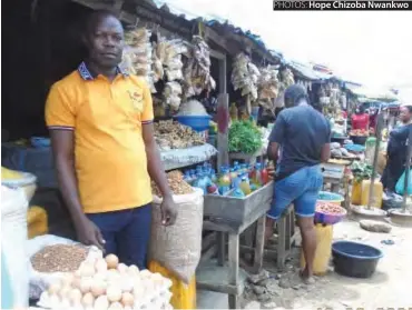  ?? PHOTOS: Hope Chizoba Nwankwo ?? Mr Kingsley Ude in front of his shop