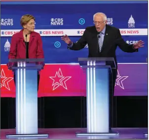  ?? (The New York Times/Erin Schaff) ?? Sen. Bernie Sanders said Tuesday night in Charleston, S.C., that “I’m hearing my name mentioned a little bit tonight. I wonder why?” Sen. Elizabeth Warren questioned Sanders’ ability to lead the country.