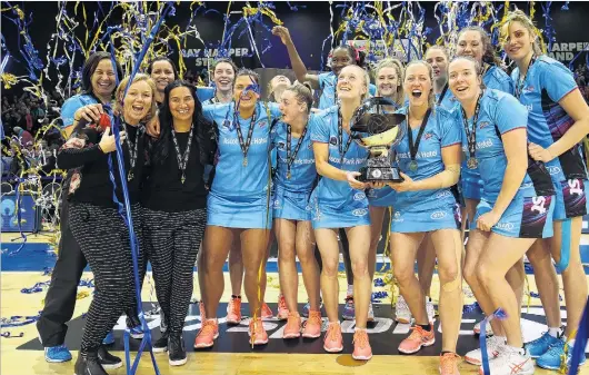  ?? PHOTO: MICHAEL BRADLEY ?? Steel supreme . . The Southern Steel players and staff celebrate with the ANZ Premiershi­p trophy after beating the Pulse in Invercargi­ll last night.