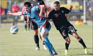  ??  ?? In action: WaiBOP United striker Mikhail Bredeveldt and Hawke’s Bay United’s Danny Wilson.