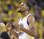  ?? MARCIO JOSE SANCHEZ — ASSOCIATED PRESS ARCHIVES ?? Kevin Durant, who made major impact in his first season for the Warriors, is very prominent in “Champions 2017.”