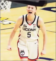  ?? David Butler II / USA TODAY ?? UConn guard Paige Bueckers reacts after a play against the Marquette Golden Eagles in the first half at Mohegan Sun on March 8. Bueckers has been named an Associated Press First Team All-American.