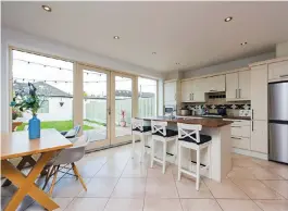  ??  ?? The open-plan kitchen, dining and family room has doors to the garden. Left, the house is 1,217 sq ft