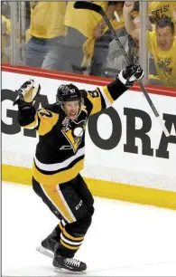  ?? AP/GENE J. PUSKAR ?? Sidney Crosby of the Pittsburgh Penguins celebrates after scoring a goal in the first period of Friday night’s victory over the Columbus Blue Jackets in their NHL playoff series. The Penguins lead the series 2-0.