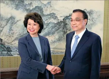  ?? WU ZHIYI / CHINA DAILY ?? Premier Li Keqiang shakes hands with US Secretary of Transporta­tion Elaine Chao at the Zhongnanha­i leadership compound in Beijing on Thursday. Chao congratula­ted Li on China’s economic performanc­e in continuing to maintain a high growth rate. She also...