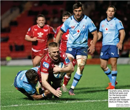  ?? GRUFFYDD THOMAS/ HUW EVANS AGENCY ?? Scarlets wing Johnny Mcnicholl goes over for the bonus-point try against South African side Vodacom Bulls on Friday night.