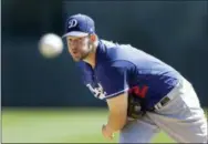  ?? CARLOS OSORIO - THE ASSOCIATED PRESS ?? Los Angeles Dodgers starting pitcher Clayton Kershaw throws warmup pitches before the first inning of a spring training baseball game against the Chicago White Sox, Friday, in Glendale, Ariz.