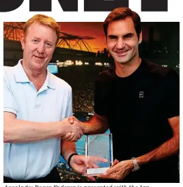  ?? GETTY IMAGES ?? Accolade: Roger Federer is presented with the Ian Wooldridge Award by Sportsmail’s Mike Dickson