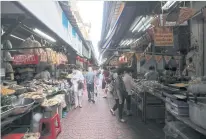  ?? CHANAT KATANYU ?? The atmosphere at Yaowarat market in Bangkok’s Chinatown during the annual vegetarian festival this year is subdued because of the pandemic.