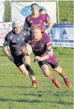  ??  ?? Try Conor Bickerstaf­f runs in a score during Marr’s tough victory