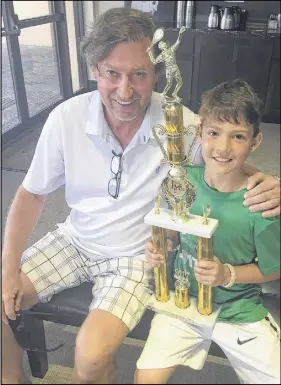  ?? SUBMITTED photo ?? Caden Colburne had his picture taken with Wayne Gretzky after winning the runner-up trophy at an internatio­nal tennis tournament in Florida. Gretzky’s daughter Emma also competed in the tournament.