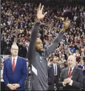  ?? Associated Press ?? TOP GUY Former Raptors and now Clippers forward Kawhi Leonard salutes the crowd as he receives his 2019 NBA championsh­ip ring prior to an NBA game on Dec. 11 in Toronto. He was named AP male athlete of the year.