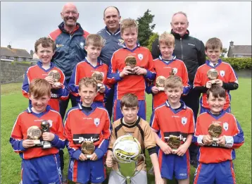  ??  ?? Curracloe United with mentors Aidan McGuire, Declan Kielthy and Tom O’Leary. Back (from left): Max Roche, Joshua Roche, Rian Ormonde, Joe O’Leary, Rory Hearne. Front (from left): Cillian O’Leary, Josh Kinsella, Liam Kielthy (capt.), Luke Corrigan,...