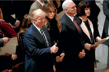  ?? PHOTO: REUTERS ?? President Donald Trump, left, and Vice-president Mike Pence, pictured at a prayer service yesterday, now face opposition from many directions.