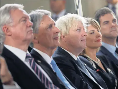  ??  ?? Cabinet ministers David Davis, Philip Hammond and Boris Johnson listen with rapt attention to their leader’s words