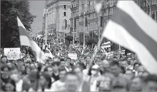  ?? MINSK
-REUTERS ?? People attend an opposition rally to protest against police brutality and to reject the presidenti­al election results in Minsk, Belarus.