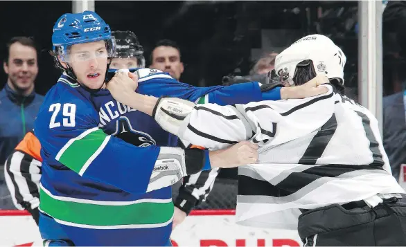  ?? JEFF VINNICK/NHLI VIA GETTY IMAGES FILE ?? Canuck defenceman Andrey Pedan fights with the Kings Jordan Nolan. The imposing defenceman has also been playing as a forward lately.