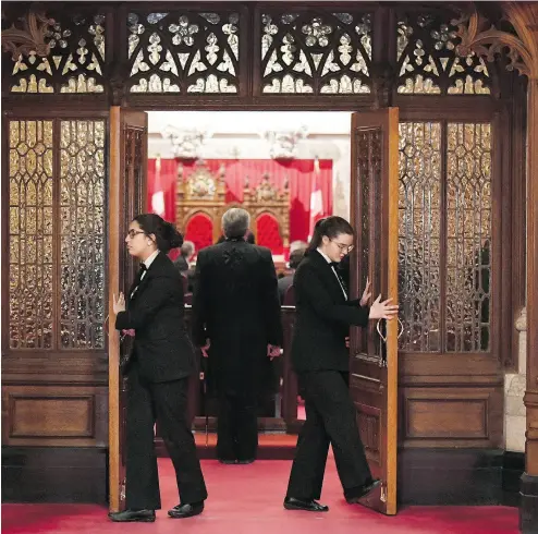  ?? JUSTIN TANG / THE CANADIAN PRESS ?? Senate pages close the doors before a vote on Bill C-45, the Cannabis Act, on Parliament Hill on Thursday.