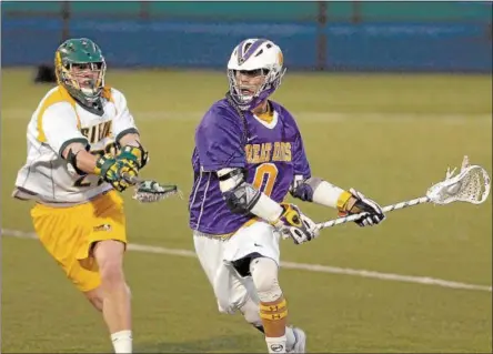  ?? THE RECORD FILE PHOTO ?? UAlbany’s Lyle Thompson (0) goes up field as Siena’s Brendan Meehan (23) defends at UAlbany on April 24, 2012.