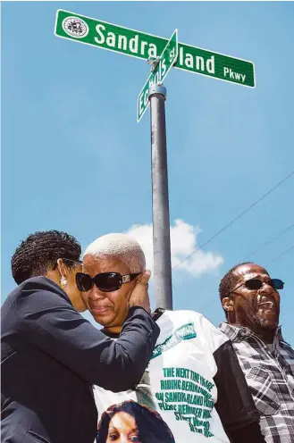  ?? Brett Coomer / Houston Chronicle ?? Geneva Reed-Veal, left, mother of Sandra Bland, embraces daughter Shante Needham during a ceremony renaming University Boulevard to Sandra Bland Parkway on Friday in Prairie View. The street was renamed for Bland, who died in custody at the Waller...