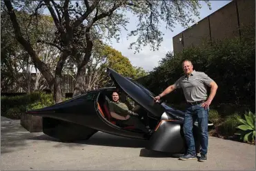  ?? Photo for The Washington Post by Jane Hahn ?? Aptera Motors CEOs Chris Anthony, left, and Steve Fambro with the three-wheel Aptera solar electric vehicle at the company’s production design facility in San Diego.