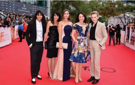  ?? GEORGE PIMENTEL ?? New indie drama Below Her Mouth’s all female crew includes from left, screenwrit­er Stephanie Fabrizi; producer Melissa Coghlan; actress Natalie Krill; director April Mullen; and actress Erika Linder.