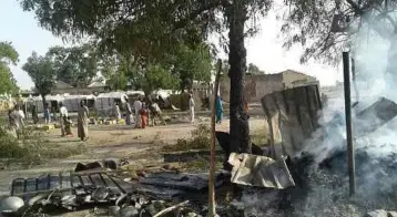  ??  ?? KEM yang menjadi sasaran serangan tentera Nigeria ini semalam menempatka­n pelarian yang melarikan diri dari kekejaman Boko Haram. - AP