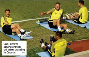  ?? AFP ?? Cool down: Spurs stretch off after training in Cyprus