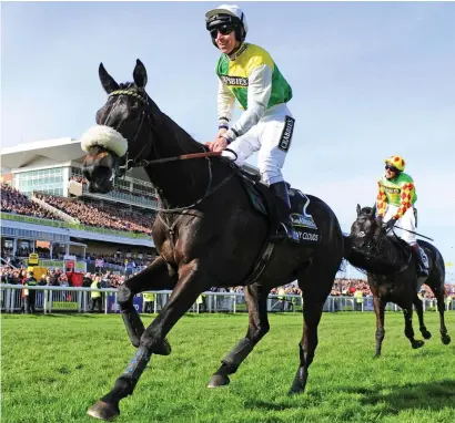  ??  ?? GRAND NATIONAL: Many Clouds, pictured beating Saint Are in last year’s Crabbie’s Grand National, will be out to follow up in the world’s most famous steeplecha­se at Aintree today.