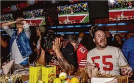  ?? Brontë Wittpenn/The Chronicle ?? San Francisco 49ers fan John Aganon holds his head in his hands at the Hi Tops bar in the Castro district after watching his team lose the Super Bowl.