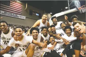  ?? The Sentinel-Record/Rebekah Hedges ?? CHAMPIONSH­IP WEEKEND: Jonesboro’s boys’ team celebrates its Class 6A state title at Bank of the Ozarks Arena Saturday, the final day of the Arkansas Activities Associatio­n’s championsh­ip weekend.