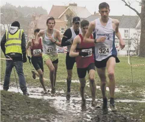  ?? Picture: Karen Cox ?? Jacob Cann on his way to his senior men’s victory in the Sussex cross-country championsh­ips