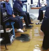  ?? Courtesy Scott Arnold ?? In a photo provided by plaintiff ’s attorney Scott Arnold, parolees living at the Southeast Texas Transition­al Center in Harris County try to avoid floodwater­s during Hurricane Harvey.