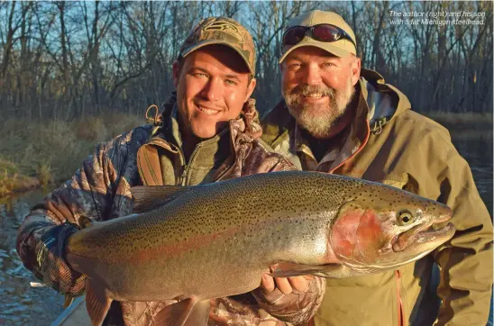  ??  ?? The author (right) and his son with a fat Michigan steelhead.