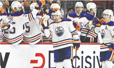  ?? JUSTIN TANG / THE CANADIAN PRESS ?? Edmonton Oilers winger Zach Hyman celebrates his 50th goal of the season
Sunday in Ottawa during a game against the Senators.