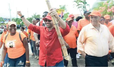  ?? FILE ?? Citizen Shane, with his sugar cane, on his way to the nomination centre last week.