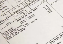  ?? Jonathan Bachman / AP ?? Making initial contact may be uncomforta­ble but calling a customer service representa­tive can help to have a bill lowered or deferred, a credit limit raised, an interest rate lowered or a fee waived.