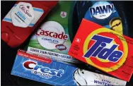  ?? CHARLES KRUPA — THE ASSOCIATED PRESS FILE ?? Procter & Gamble Co. raised its full-year sales outlook Thursday, although it cautioned that higher commodity prices continue to squeeze profits.