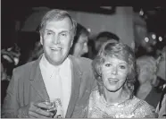  ?? DOUG PIZAC/AP FILE PHOTO ?? Actors Alan Sues and Judy Carne of “Rowan And Martin’s Laugh-In,” are shown in this Sept. 13, 1983, photo during a “Laugh-In” reunion party in Los Angeles. Carne has died in a British hospital. She was 76.