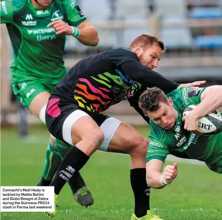  ??  ?? Connacht’s Matt Healy is tackled by Mattia Bellini and Giulio Bisegni of Zebre during the Guinness PRO14 clash in Parma last weekend