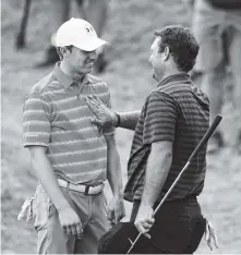  ?? THE ASSOCIATED PRESS ?? Patrick Reed , right, pats Jordan Spieth on the chest after defeating him in the Dell Technologi­es Match Play on Friday in Austin, Texas.