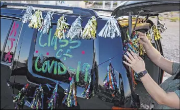  ?? Las Vegas Review-Journal @csstevensp­hoto ?? Chase Stevens
Desert Oasis High holds a senior prom parade in May. Student councils at Desert Oasis, Frias Elementary School and Tarkanian Middle School teamed up for a PBJ-athon — a virtual sandwich-making marathon to benefit the Care Complex of Southern Nevada.