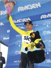  ??  ?? Bernal Gomez, of Colombia, waves to fans as he wears his Race Leader Jersey after winning Stage 2 of the AMGEN Tour of California on Monday, , in Santa Barbara. AP PHOTO/MARK J. TERRILL