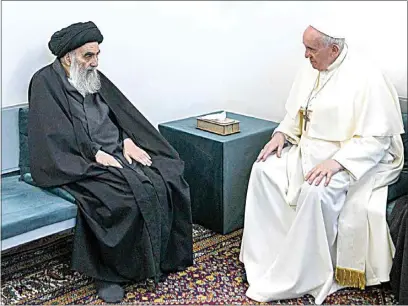  ?? VATICAN MEDIA VIA AP ?? Pope Francis, right, meets with Iraq’s leading Shiite cleric, Grand Ayatollah Ali al-Sistani in Najaf, Iraq, on Saturday.