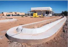  ?? EDDIE MOORE/JOURNAL ?? The new security check-in building being built outside Santa Fe Indian School is part of a project aimed at improving access to the school.