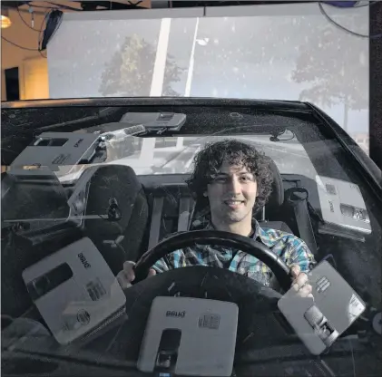  ?? CP PHOTO ?? Benjamin Cortens, a computer science graduate student at the University of Guelph, poses for a photo in the DRIVE lab at the University of Guelph in Guelph, Ont. on Wednesday, Jan.31, 2018.