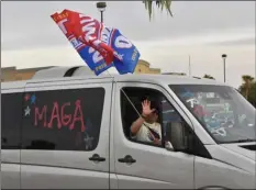  ??  ?? TOP: An estimated 400 cars and trucks participat­ed in a parade in Imperial Valley Saturday to show support for President Donald Trump.