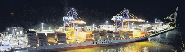  ?? PHOTO: GERARD O’BRIEN ?? Unaffected . . . normal operations for Maersk line vessels; pictured, Lexa Maersk being loaded at Port Chalmers in the early hours of Tuesday this week.