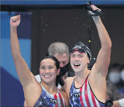  ?? TOM PENNINGTON — GETTY IMAGES ?? Katie Ledecky, right, celebrates with U.S. teammate Erica Sullivan after they took gold and silver in the women’s 1,500freesty­le at the Olympics.