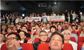  ?? Photograph: Tomohiro Osaki/AFP/Getty Images ?? Call of the Tanakas: people named Hirokazu Tanaka gather in a Tokyo cinema for their successful attempt on the Guinness World Record for largest gathering of namesakes.